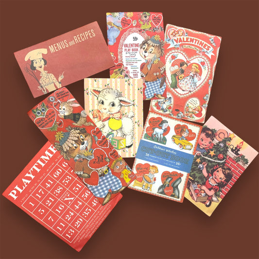 A mix of colorful retro-themed stickers featuring vintage valentines, recipe books, animals, and playful illustrations, arranged on a brown background.